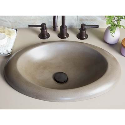 Earth-toned round drop-in sink with three bronze faucet handles and matching drain cap.