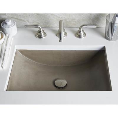 Rectangular undermount bathroom sink with earth-tone finish, dual faucet holes, and center drain opening.