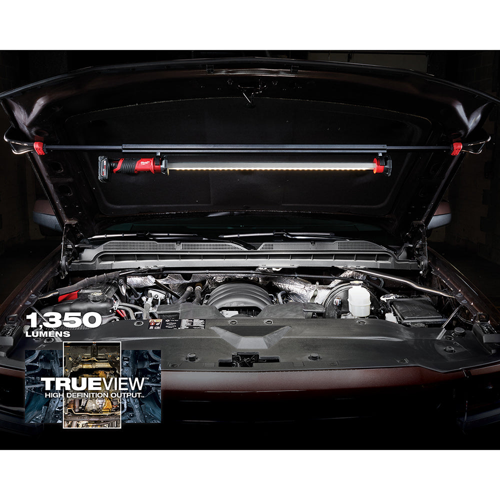 M12 LED underhood light with red mounting brackets illuminating an open car engine bay.