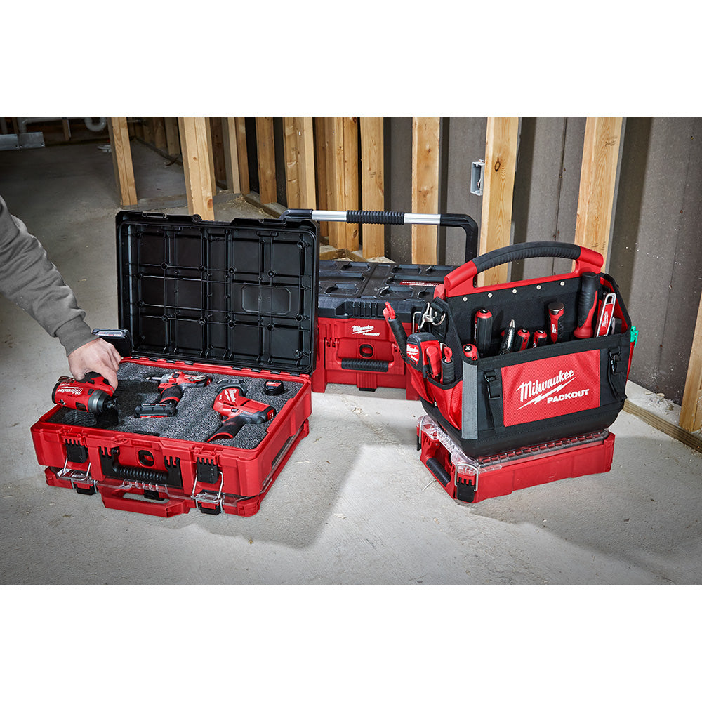 Red and black Milwaukee PACKOUT tool case with foam insert, open to show interior storage compartments and black lid.