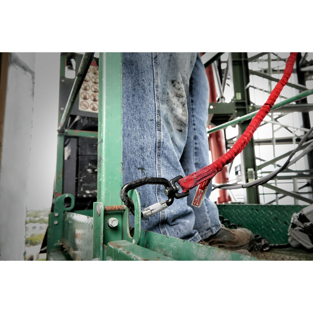 Red extended reach tool lanyard with black carabiner clip attached to worker's belt on construction scaffolding.