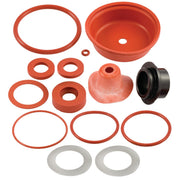 FEBCO rubber parts kit containing red seals, gaskets, rings, a dome cap, and black fitting arranged on white background.