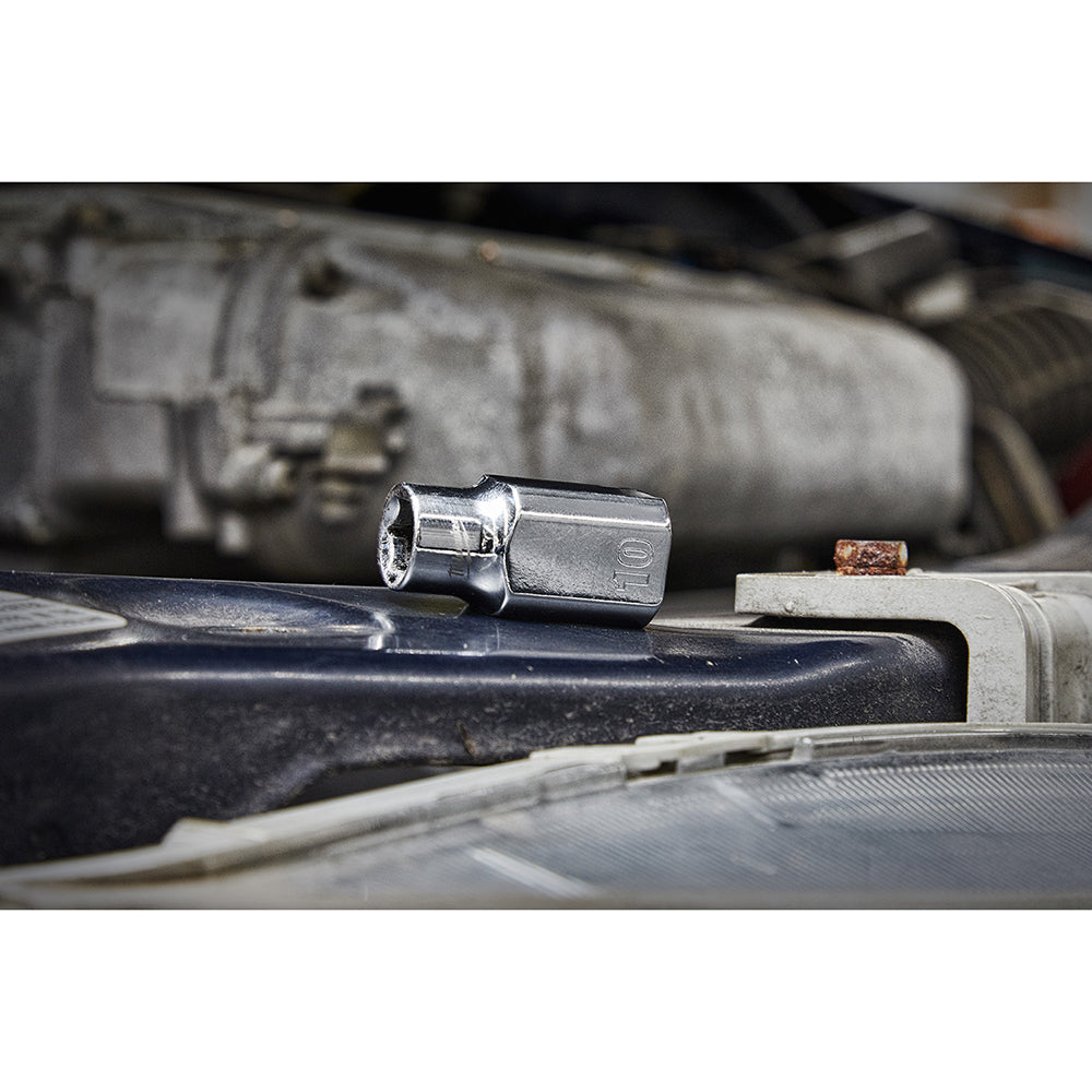 Chrome metric socket with four flat sides positioned on engine component.