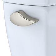 Brushed nickel trip lever with curved handle mounted on white toilet tank.