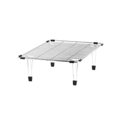 Stainless steel sink grid with parallel wire construction, black corner clips, and clear rubber feet for elevation.