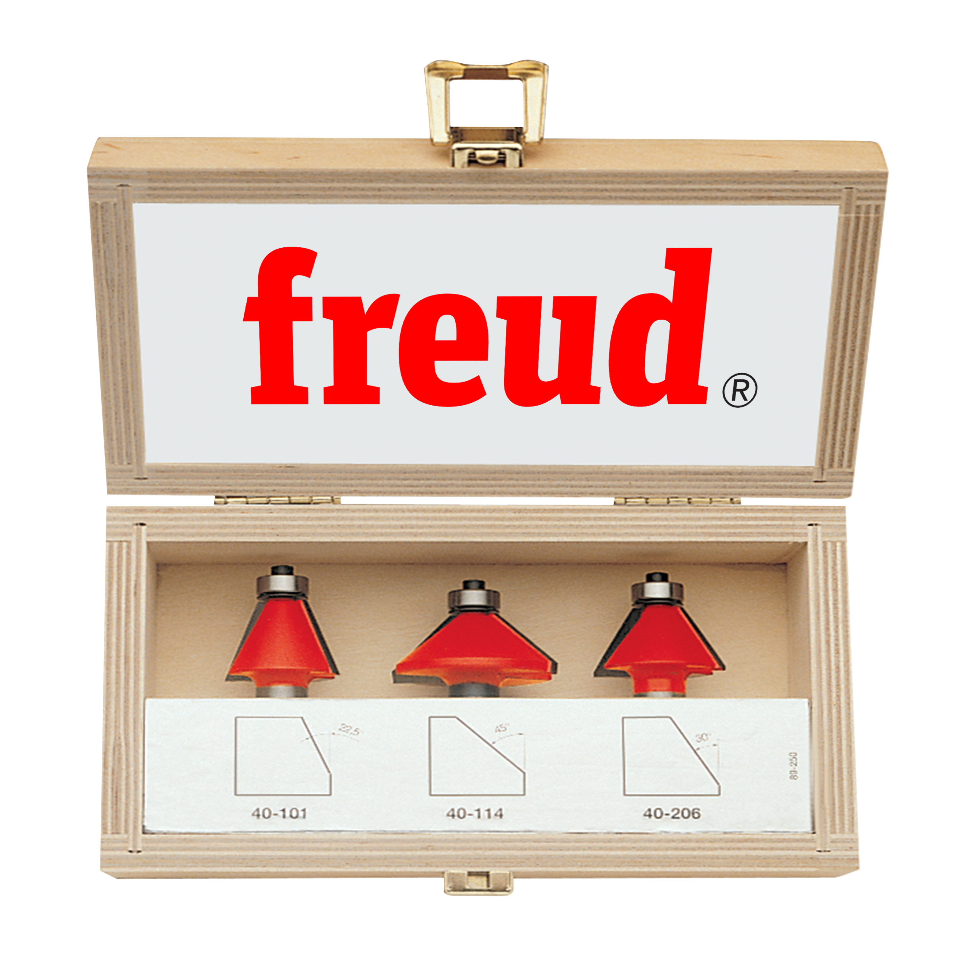 Three red chamfer router bits with metal shanks in a wooden Freud storage box.