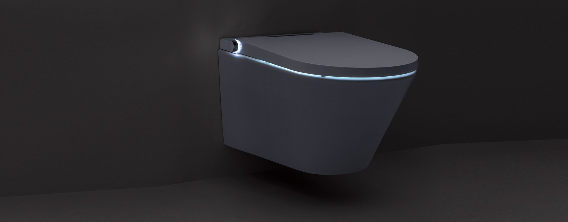 White and chrome wall-hung intelligent toilet with curved edges and blue accent lighting on the seat.
