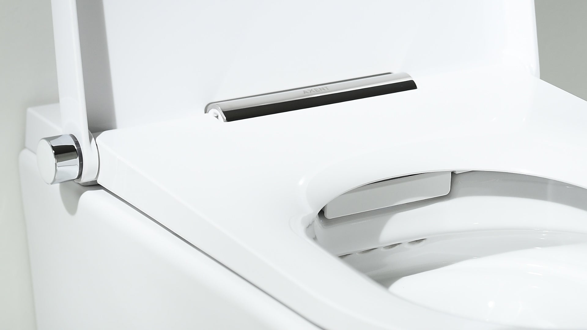 White wall-hung intelligent toilet with chrome controls, sensor panel, and integrated bidet features.