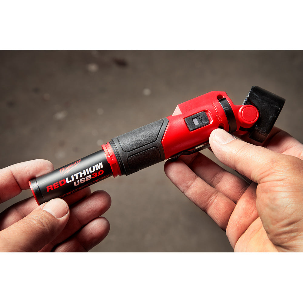 Two red and black Milwaukee REDLITHIUM USB batteries with digital display held in hand.