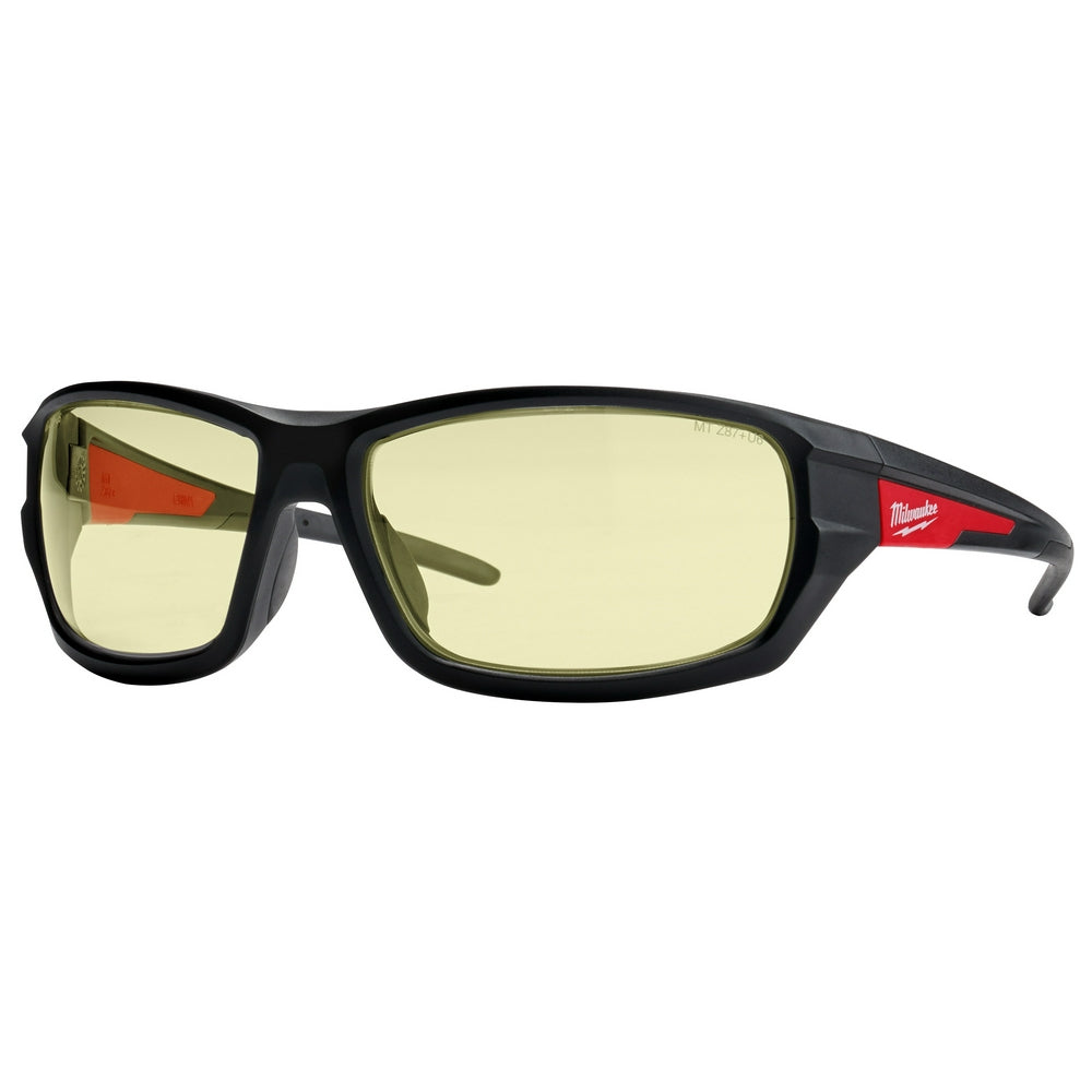 Black safety glasses with yellow lenses and red accents on the temples.