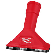 Red utility nozzle with black bristle brush strip along bottom edge and cylindrical attachment shaft.