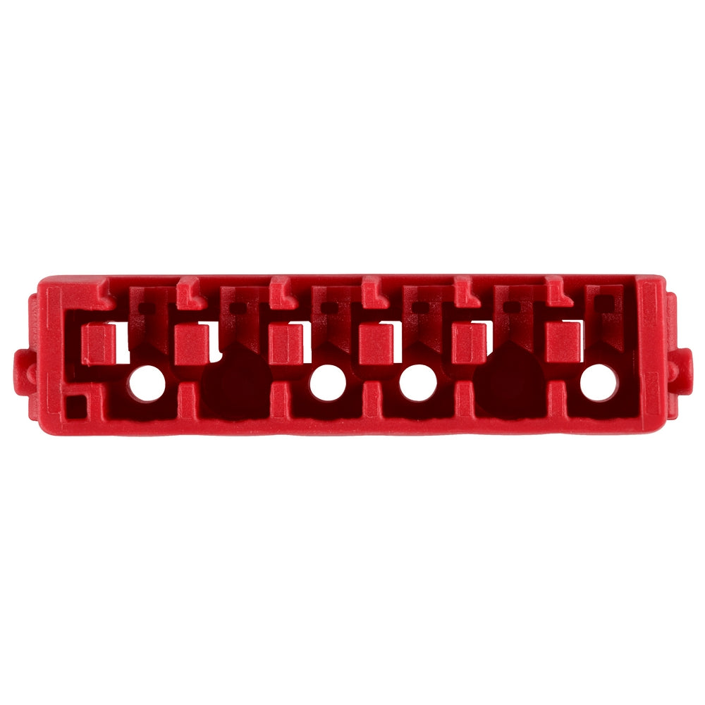 Red plastic organizer insert with four compartments and white circular holes for bit storage.