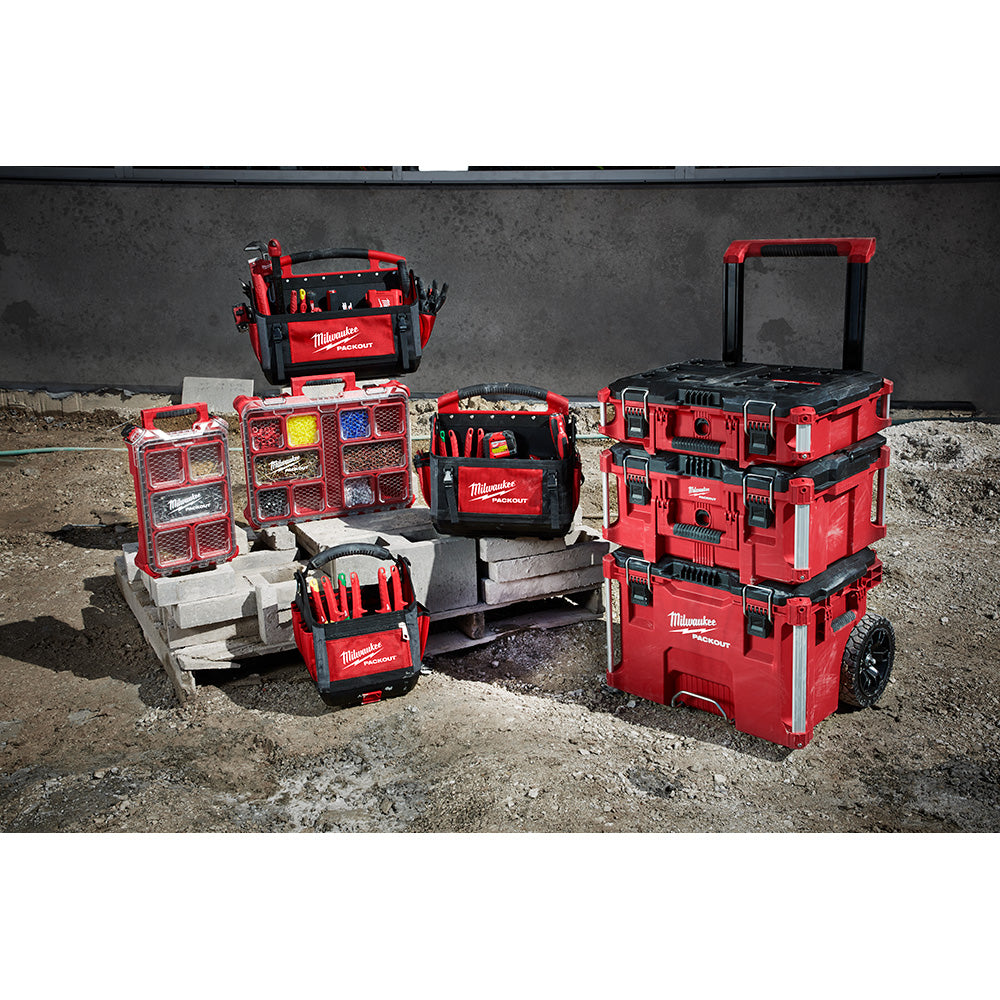 Red and black Milwaukee PACKOUT tote with dual handles and compartments for tool storage and organization.