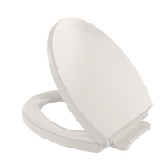 Round toilet seat and lid in sedona beige with closed lid positioned at an angle showing the seat below.
