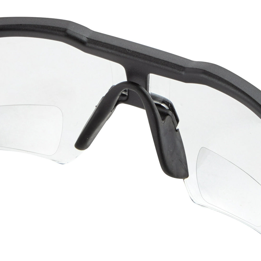 Black safety glasses with clear magnified lenses and adjustable nose bridge, shown from front angle.