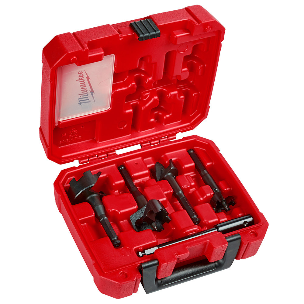 Four black selfeed drill bits with different sizes stored in a red molded plastic carrying case with handle.