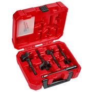 Four black selfeed drill bits with different sizes stored in a red molded plastic carrying case with handle.