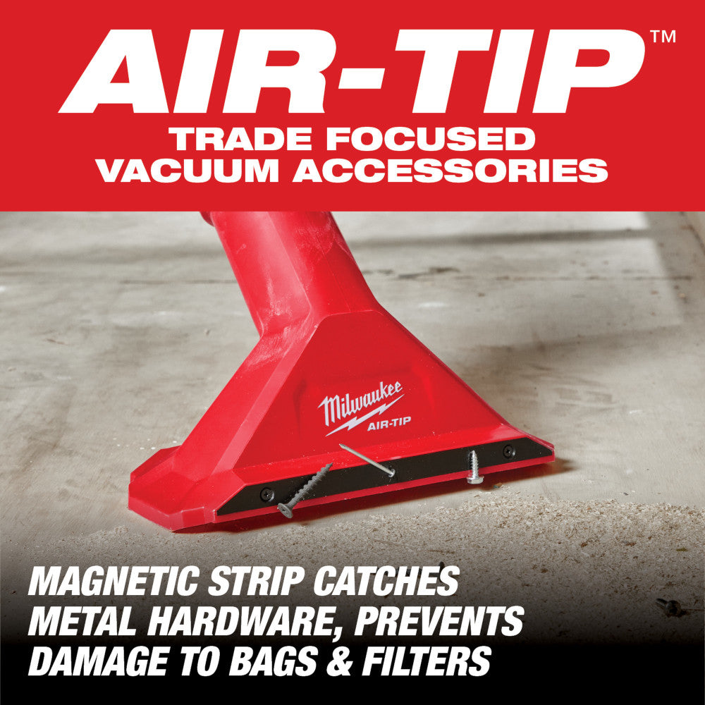 Red Milwaukee AIR-TIP magnetic utility nozzle with black base strip on concrete surface.