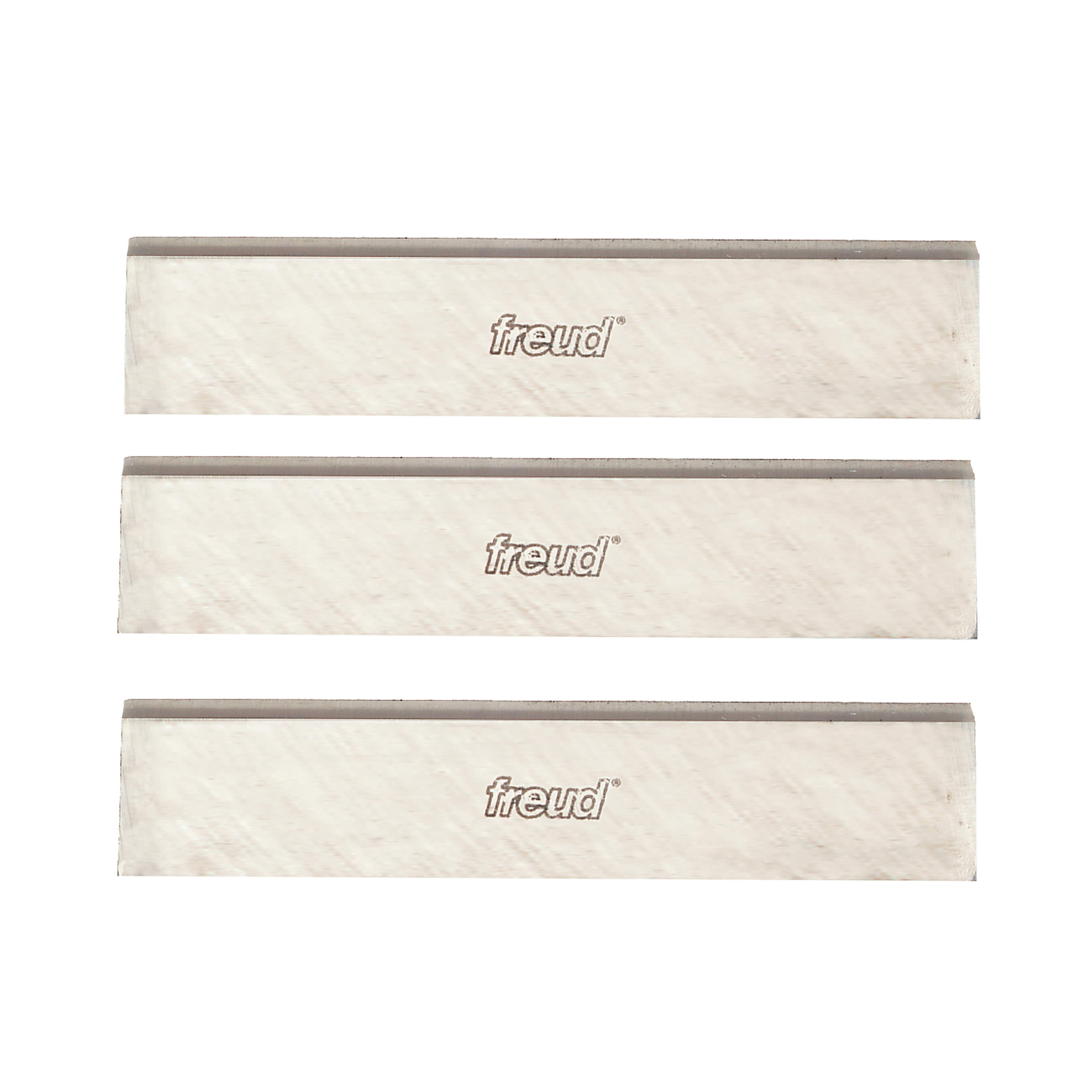 Three 4-inch Freud high speed steel planer and jointer knives with gray cutting edges and cream-colored bodies.