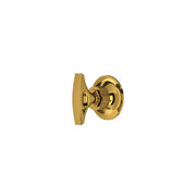 Unlacquered brass volume control and diverter trim with round escutcheon and lever handle.