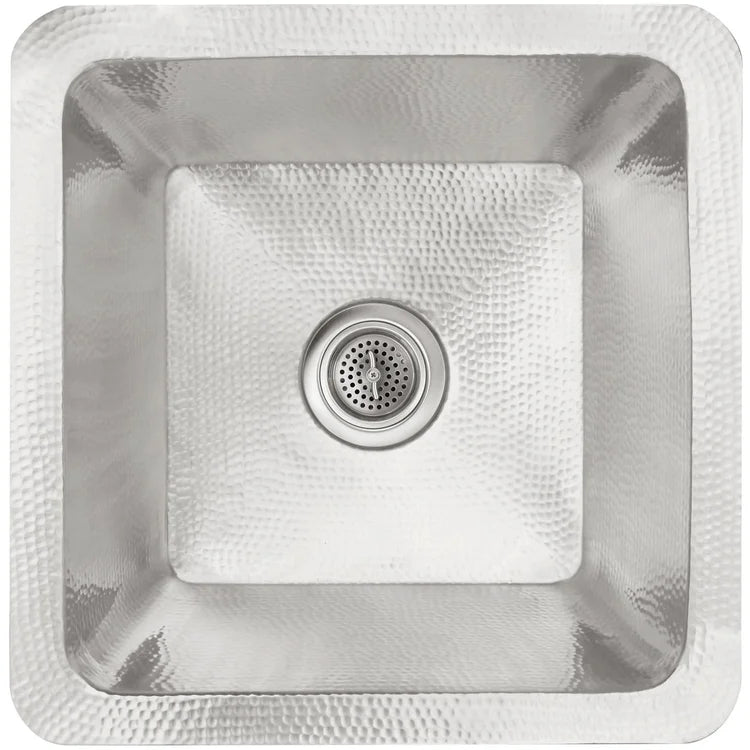 Stainless steel square bathroom sink with hammered texture and centered drain opening, viewed from above.
