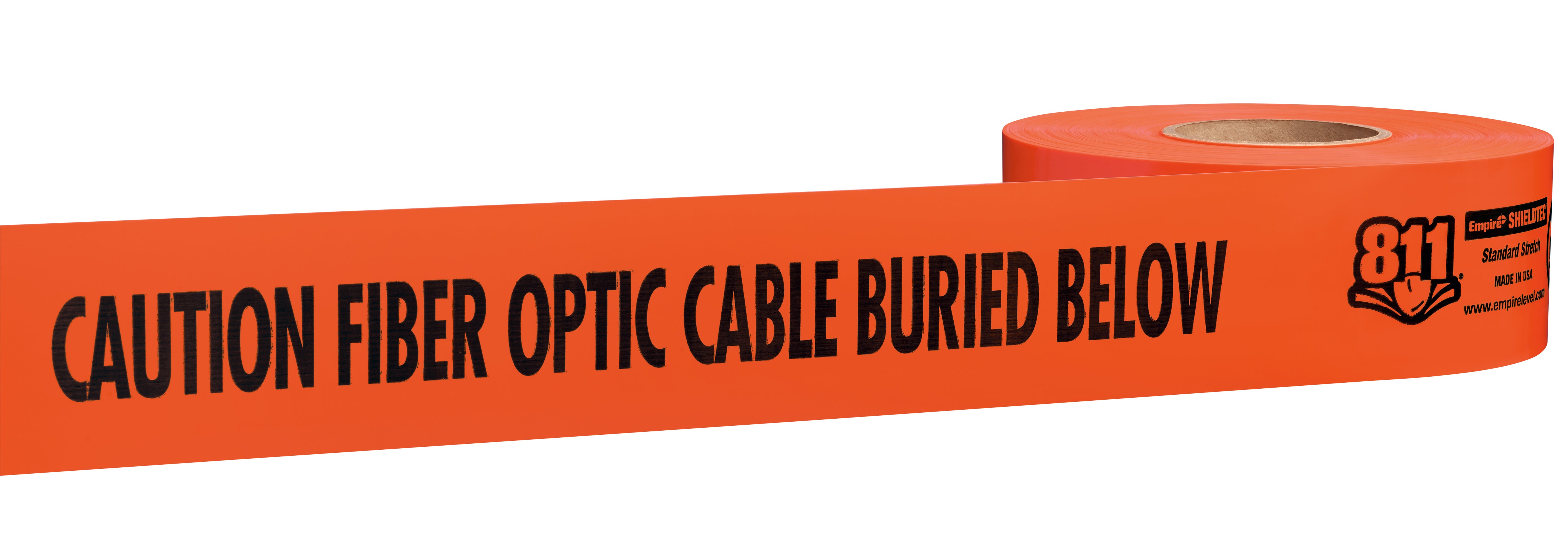 Orange warning tape roll with black text reading "CAUTION FIBER OPTIC CABLE BURIED BELOW" and manufacturer logo.