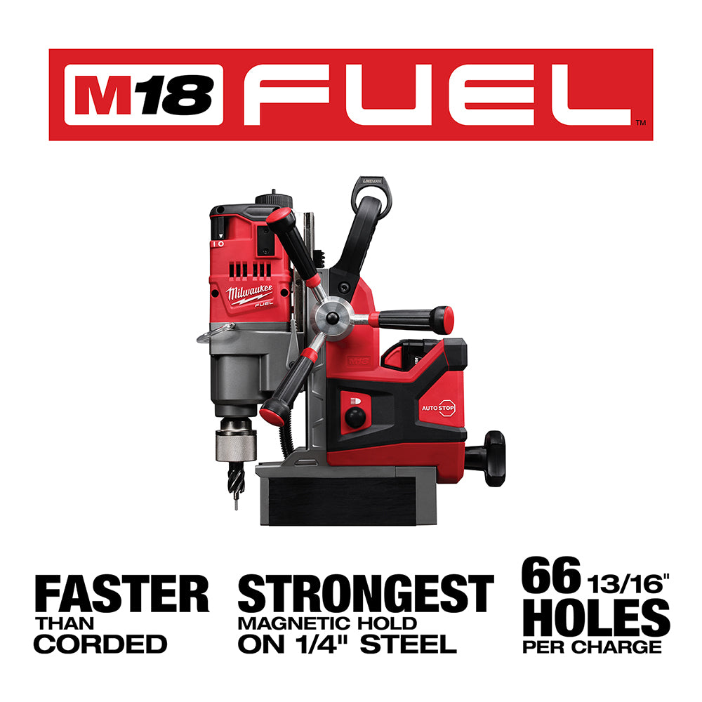 Red and black Milwaukee M18 FUEL magnetic drill press with handle, chuck, and magnetic base on platform.