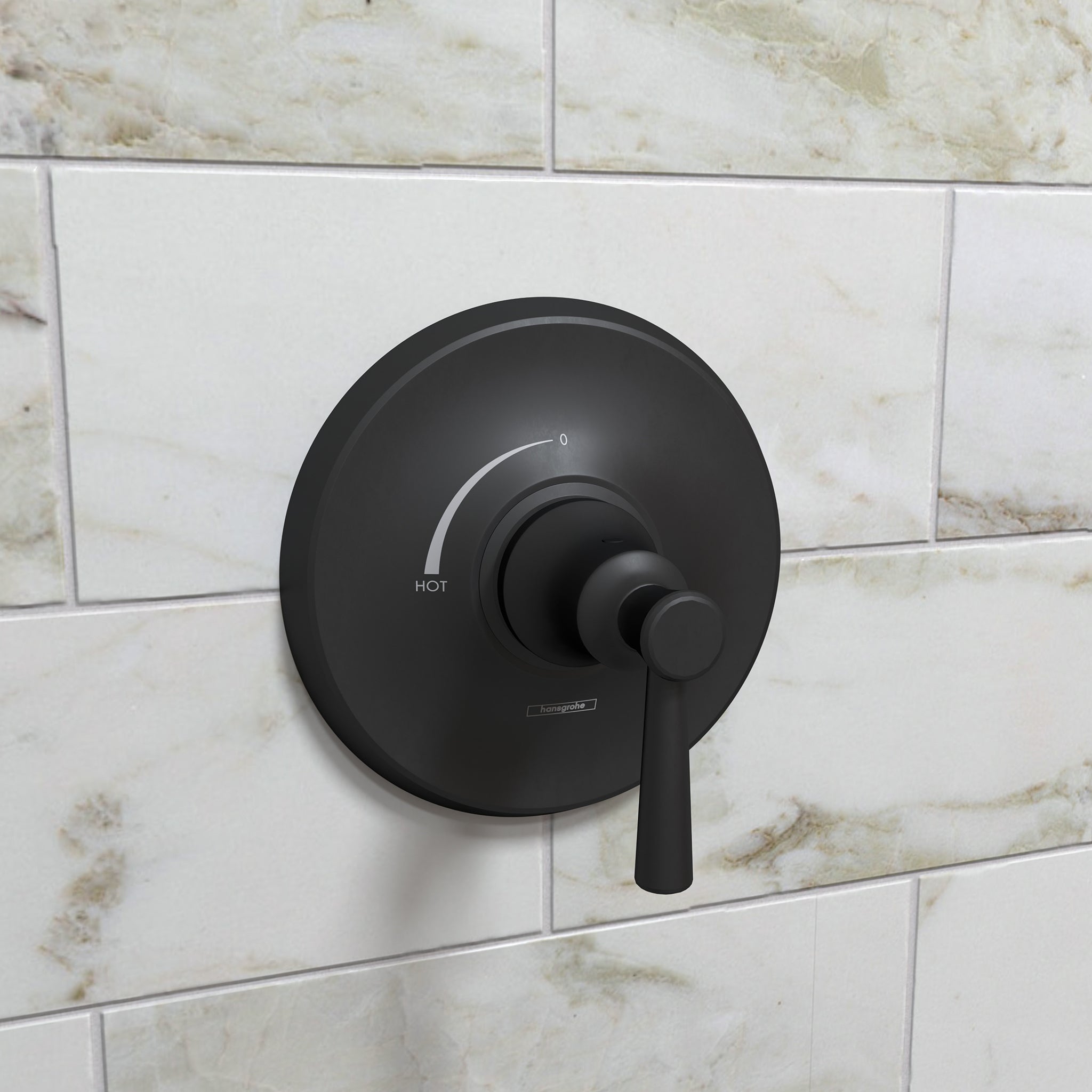Matte black round pressure balance valve trim with single lever handle mounted on marble subway tile wall.