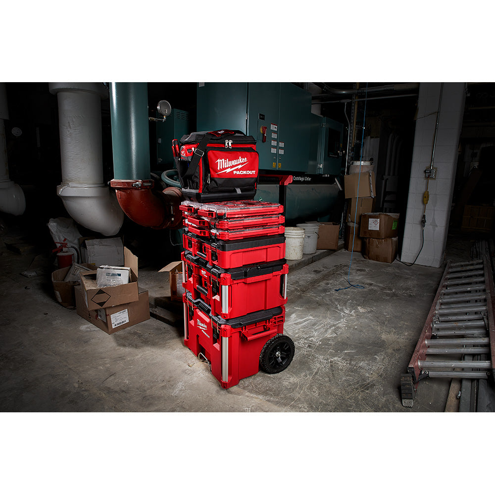 Red and black Milwaukee PACKOUT cooler with wheels and handle, stacked modular storage design.