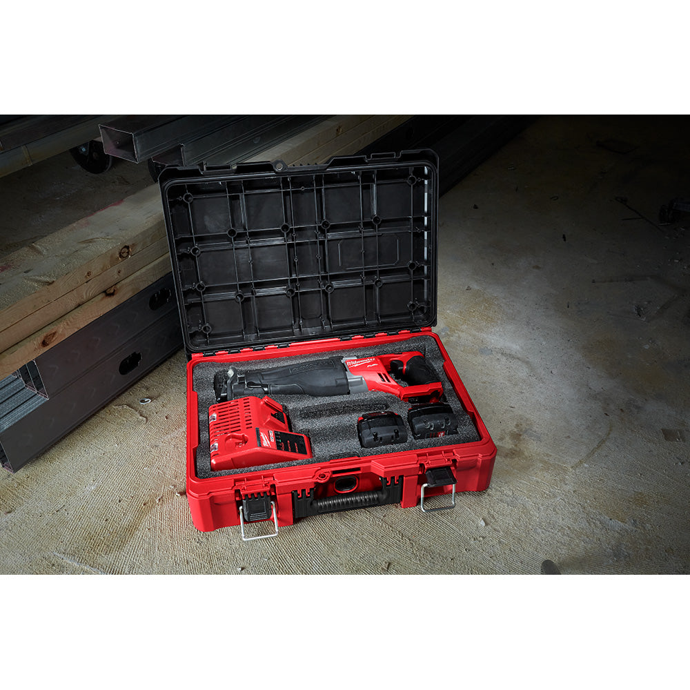 Red PACKOUT case with gray foam insert holding power tools and accessories.