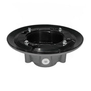 Black and gray drain body with threaded center opening, wide flange top, and mounting bolts around perimeter.
