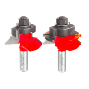 Two red V-shaped router bits with silver shanks and black hex heads, shown from different angles.