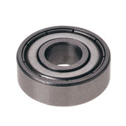 Metal ball bearing with concentric circular grooves and central shaft opening.