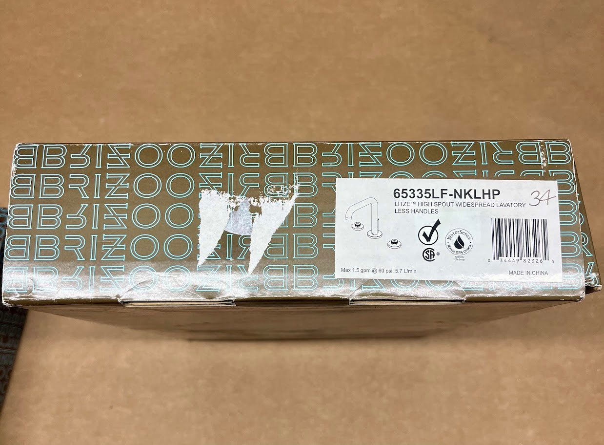 Brizo Litze chrome widespread lavatory faucet in open box with product label and specifications visible.
