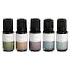 Five nail polish bottles in neutral shades ranging from beige to gray, arranged in a row.