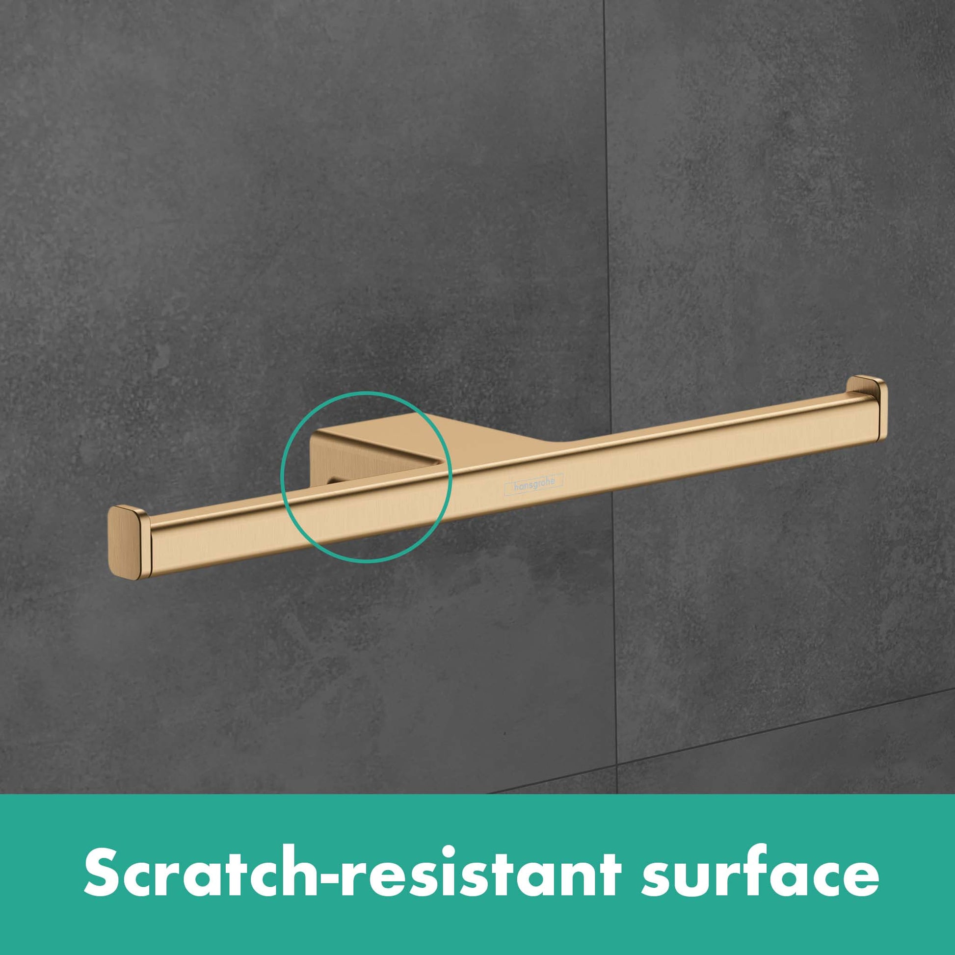 Brushed bronze wall-mounted toilet paper holder with horizontal rod and square mounting plates against gray tile.