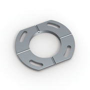 Gray metal drain component with central circular opening and four rectangular slots around perimeter.