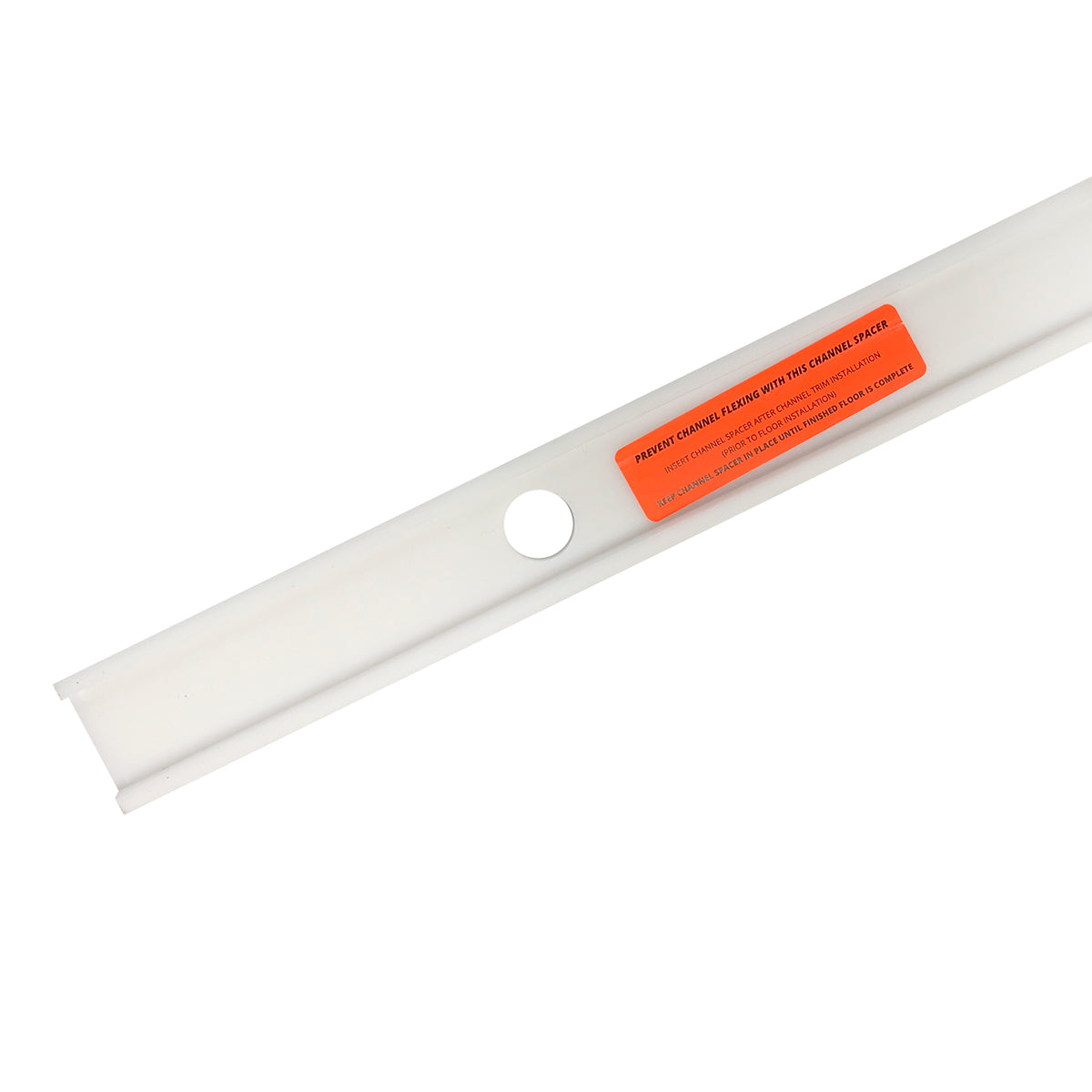 White linear drain component with circular opening and orange warning label attached.