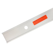 White linear drain component with circular opening and orange installation label on top surface.
