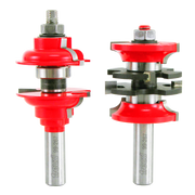 Two red and silver router bits with metal shafts and various cutting heads for woodworking applications.