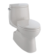 Toto Carlyle one-piece skirted toilet in beige with closed seat lid and tank visible from side angle.