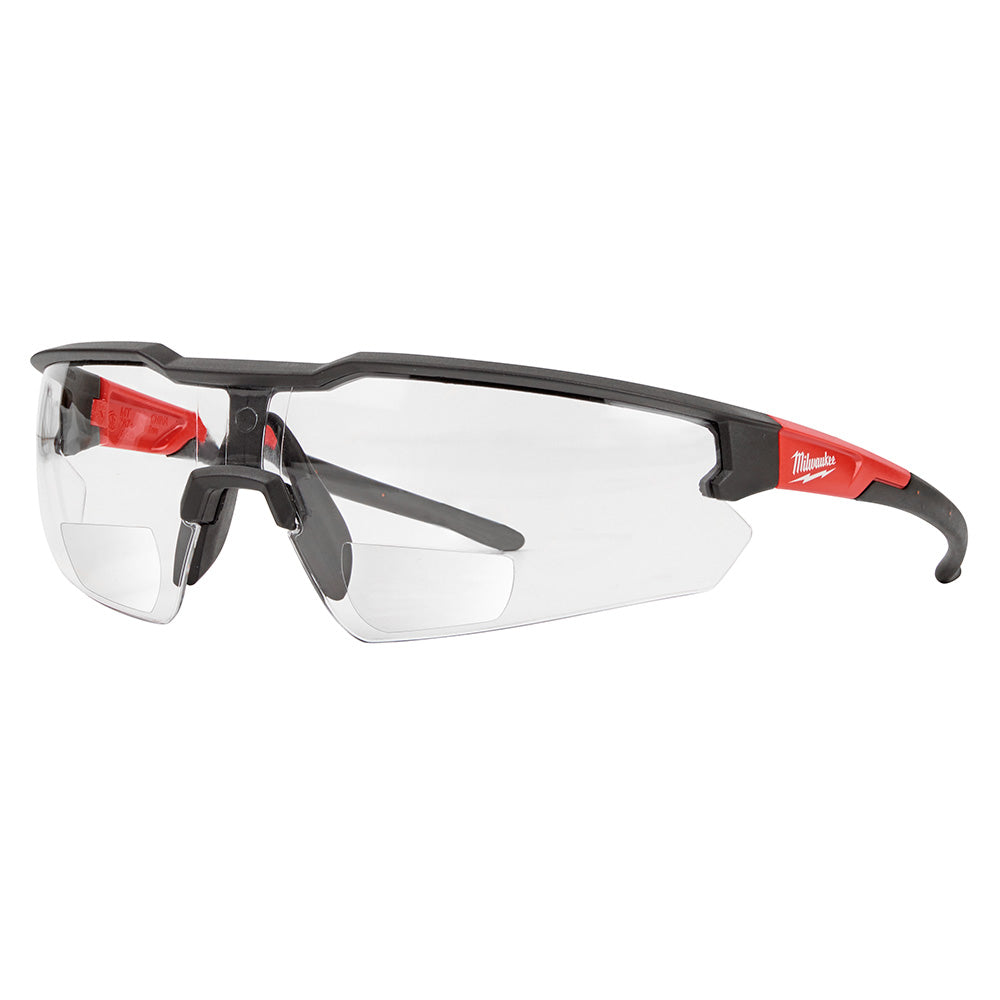 Milwaukee safety glasses with clear magnified lenses, black frames with red accents, and curved arms.