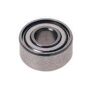 Metal ball bearing with concentric grooves and central hollow opening, shown from top angle.