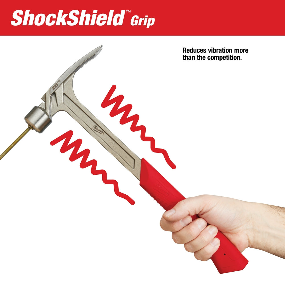 Framing hammer with milled face, curved claw, and red shock-absorbing grip held in hand.