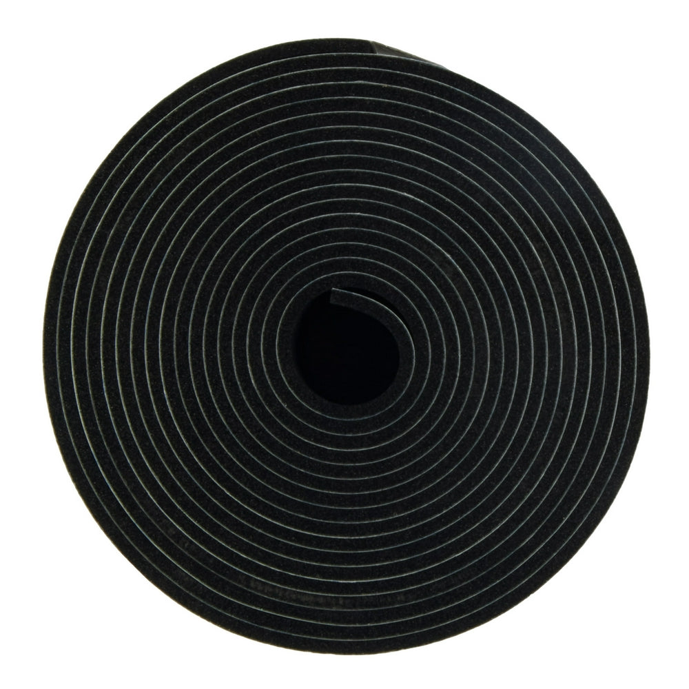 Black non-slip strip with concentric circular grooves, coiled into a roll with center hole visible.
