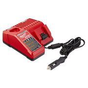 Red Milwaukee DC charger with ventilation slots and attached black power cord with car adapter plug.