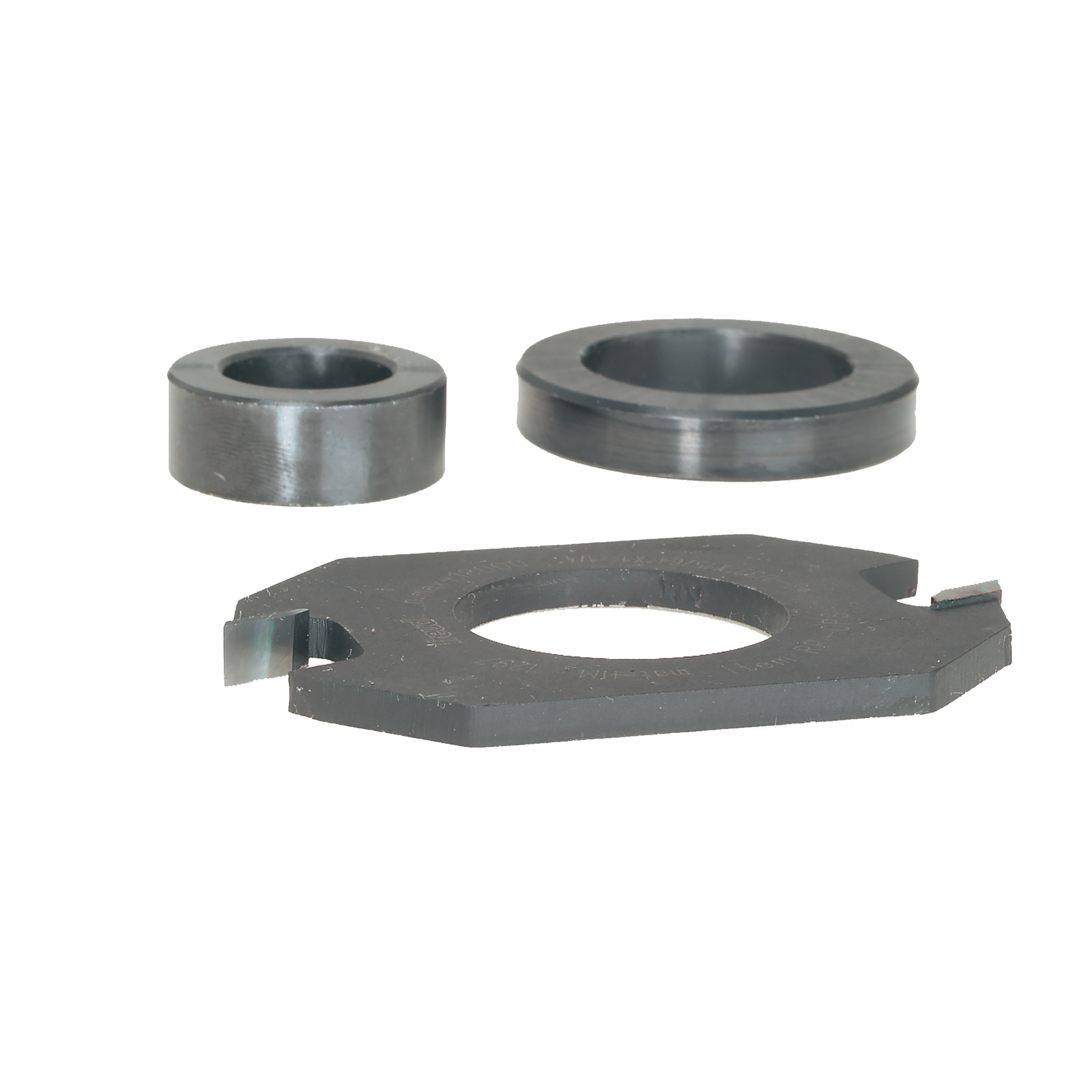 Three steel router bit components: two cylindrical spacers and one flat cutting ring with central hole.