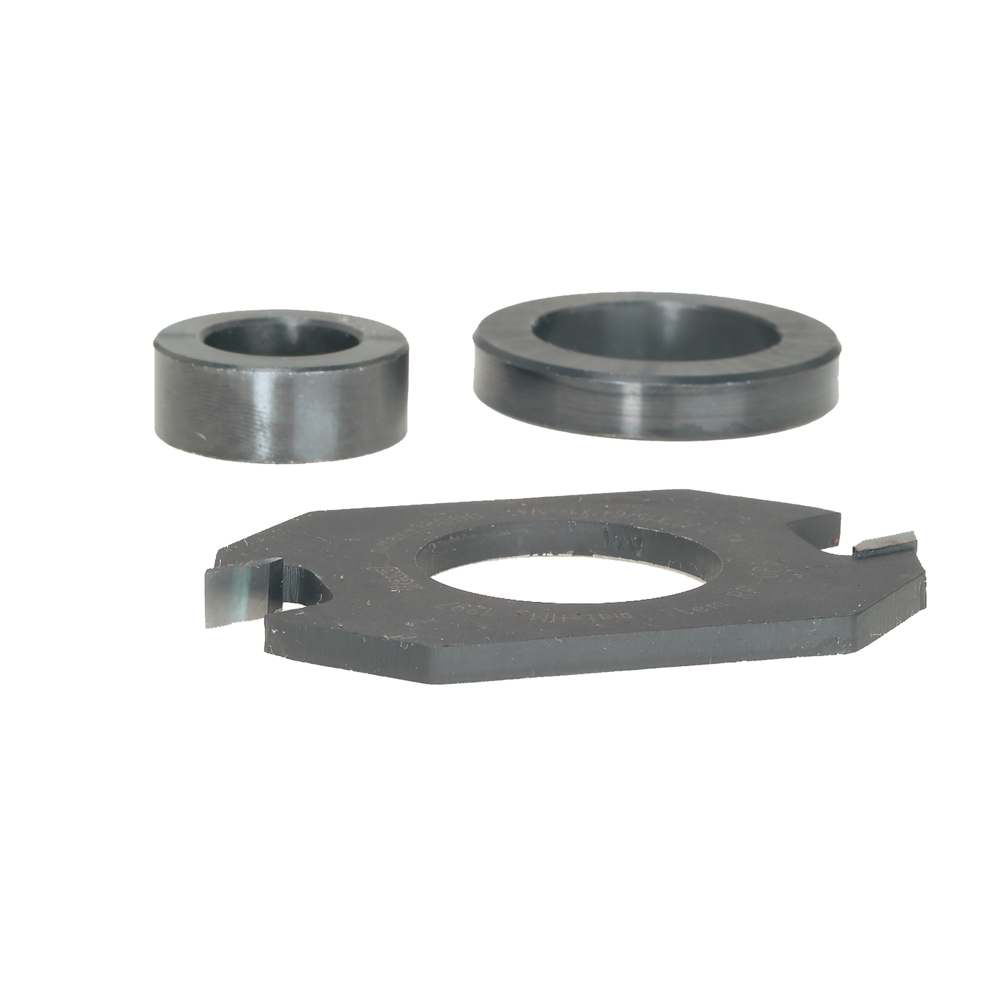 Three steel router bit components: two cylindrical spacers and one flat cutting ring with central hole.