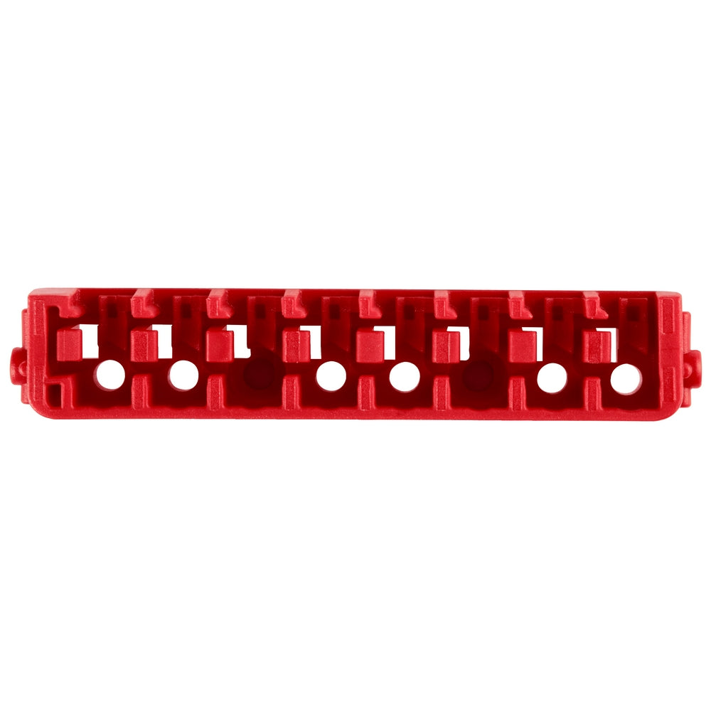 Red plastic insert bit case row with multiple compartments and circular holes for organizing small accessories.