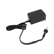 Black plug-in power adapter with cord and barrel connector for commercial soap dispenser.